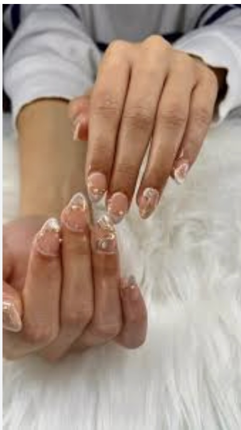 Nude nails with glitter French detailing